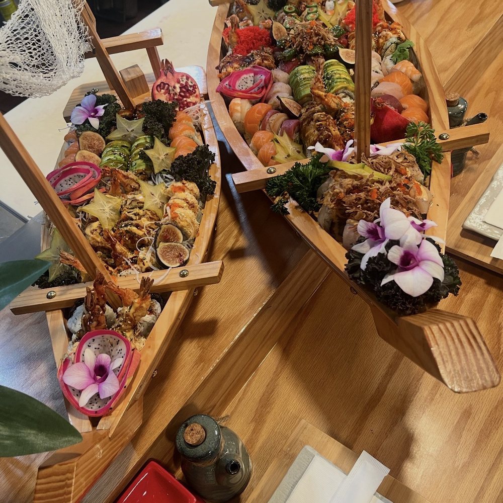 Here are the two sailboats filled with a variety sushi Here are the two sailboats filled with a variety sushi