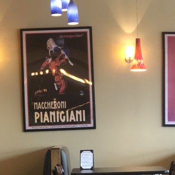 Pinocchio's Pizza - Some of the posters (crooked but ‍) and the cute lighting. - Pizza Near Me - Pasadena, California