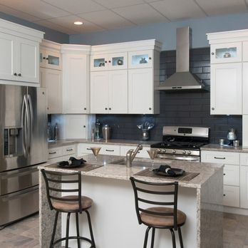 Mr Fix It - a kitchen with white cabinets and stainless steel appliances - Handyman Near Me Mr Fix It - a kitchen with white cabinets and stainless steel appliances - Handyman Near Me