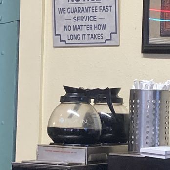 Hog Wild Cafe - a coffee maker and a sign on the wall - Cafes Near Me - Billings, Montana Hog Wild Cafe - a coffee maker and a sign on the wall - Cafes Near Me - Billings, Montana