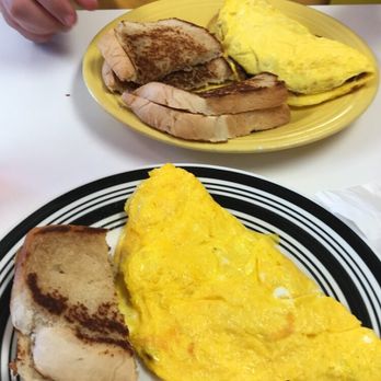 Country Time Cooking - Omelettes with "homemade toast". The toast is not very photogenic but it was delicious, as were the omelettes - American Near Me - Buckhannon, West Virginia
