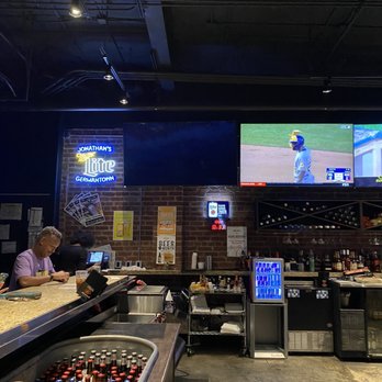 Jonathans Grille - a baseball game being played on tv - Sports Bars Near Me - Nashville, Tennessee