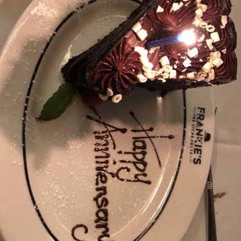 Frankie's The Steakhouse - An enormous block of multi layered chocolate cake with "Happy Anniversary" beautifully spelled out in piped chocolate. - Steakhouses Near Me - Duluth, Georgia Frankie's The Steakhouse - An enormous block of multi layered chocolate cake with "Happy Anniversary" beautifully spelled out in piped chocolate. - Steakhouses Near Me - Duluth, Georgia