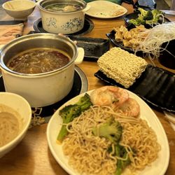Taste Place - Hot Pot Dinner. Hot & spicy broth, Original Broth, chicken, shrimp, broccoli, bean curd, enoki, rice noodle, instant noodle.
