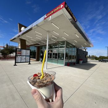 Andy's Frozen Custard - a hand holding a cup of ice cream - Ice Cream & Frozen Yogurt Near Me - Fort Worth, Texas