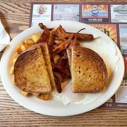 D&J's Hash House - Two eggs, sausage, bacon, rye, toast, and home fries