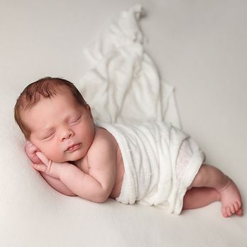 Danielle Bustamante Photography - Newborn Portrait of baby boy in ivory wrap. - Session Photography Near Me - Derry, New Hampshire Danielle Bustamante Photography - Newborn Portrait of baby boy in ivory wrap. - Session Photography Near Me - Derry, New Hampshire