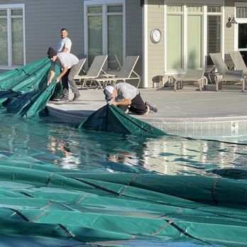 Pool DoctoRx and Spa - The Pool DoctoRx Closing Team prepares another huge commercial pool cover for winter safety - Pool Cleaners Near Me - Boise, Idaho