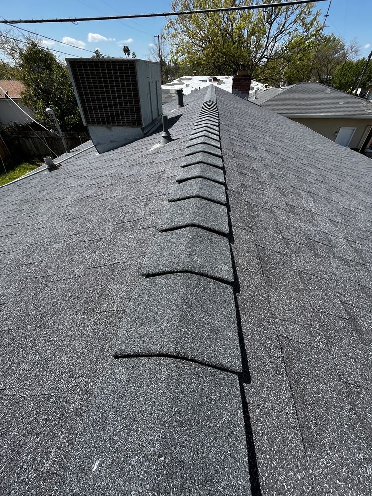 Slide of Los Reyes Roofing