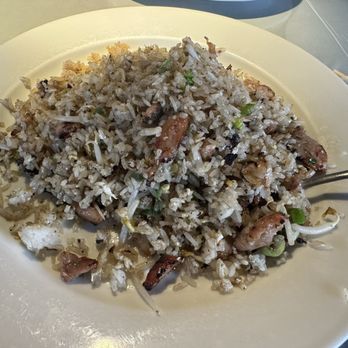 Cafe Da Lat - Charbroiled chicken fried rice. - A large white plate holds fried rice with vegetables, small pieces of meat, and bean sprouts, served at a restaurant. - Vietnamese Near Me - Albuquerque, New Mexico