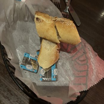 Campisi's Restaurant - Sad basket of bread with butter packets - Italian Near Me - Fort Worth, Texas