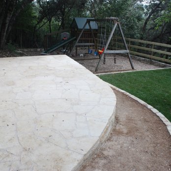 Outdoor Designs - a backyard with a swing set - Landscaping Near Me - Hutto, Texas