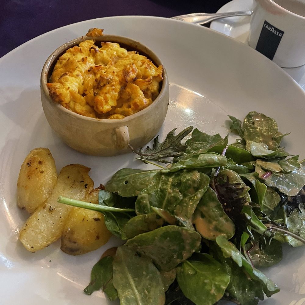 Cafe Monet - Oeuvre a la Ratatouille - baked eggs cassoulet, herbs salad - French Near Me - Millburn, New Jersey Cafe Monet - Oeuvre a la Ratatouille - baked eggs cassoulet, herbs salad - French Near Me - Millburn, New Jersey