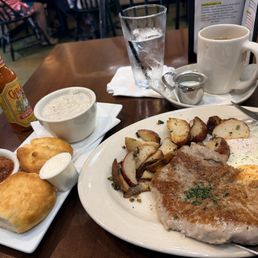 Pork loin and eggs along with biscuits and gravy Pork loin and eggs along with biscuits and gravy