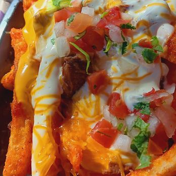 Taco Bell - $5.49 Steak Garlic Nacho Fries (under the Specialties menu) - Fast Food Near Me - Rohnert Park, California Taco Bell - $5.49 Steak Garlic Nacho Fries (under the Specialties menu) - Fast Food Near Me - Rohnert Park, California