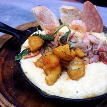 Surisan - Soufflegg Skillet: soft steamed egg topped with scampi shrimp, baby kale, cherry pepper, onion, parmesan crispy yukon potato, toast ($23). - Korean Near Me - San Francisco, California