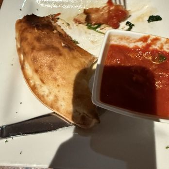 Casa Pasta - My husbands calzone. Looks good, spinach was off. - Italian Near Me - Helotes, Texas