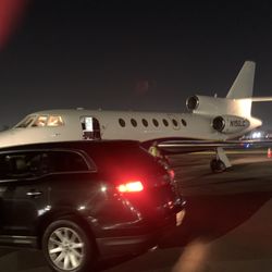 A Better Class Limousine & Sedan - Sedan pick up on tarmac