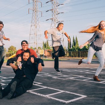 Improv Collective - a group of people jumping in the air - Comedy Clubs Near Me - Costa Mesa, California Improv Collective - a group of people jumping in the air - Comedy Clubs Near Me - Costa Mesa, California