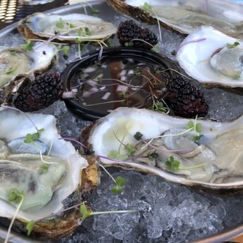 At The Corner - Fresh (Connecticut) oysters on half-shell.  Served with 6 oysters but one person in party ate one before i snapped photo! - Beer Bar Near Me - Litchfield, Connecticut