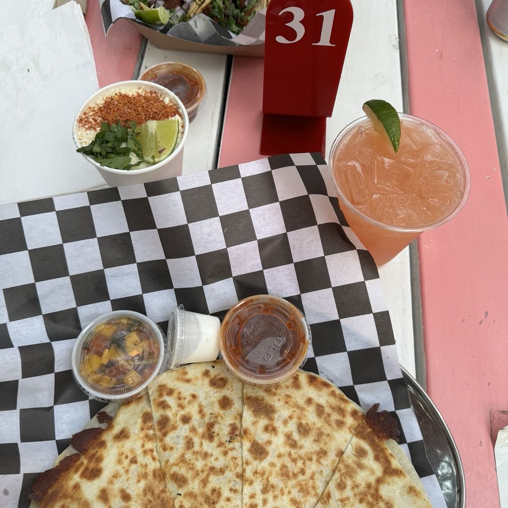Esquite, carne asada quesadillas, 3 tacos and the Blood orange mule