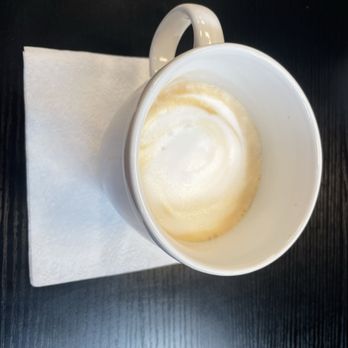 Good Karma Coffee Cafe - Flat white in mug - Coffee & Tea Near Me - St. Augustine, Florida