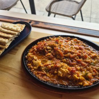 Mevan Coffee& Breakfast - Menemen & pita (what's not shown is it bubbling on the cast iron) - Coffee Roasteries Near Me - San Diego, California Mevan Coffee& Breakfast - Menemen & pita (what's not shown is it bubbling on the cast iron) - Coffee Roasteries Near Me - San Diego, California