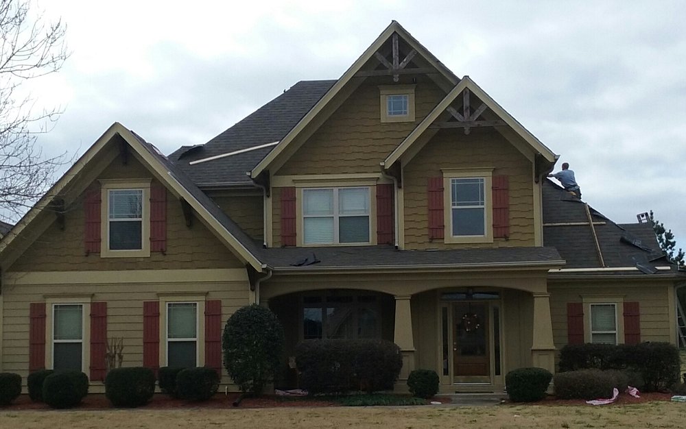 Slide of Tim's Roofing