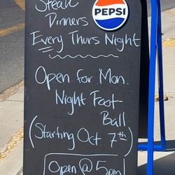 Farmers Den - An A-frame in front announced the specials and hours.