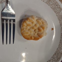 KFC - Biscuit smaller than my fork tines. Top of the biscuit was crunchy...old? Biscuits should be soft and fluffy. Butter was not included.