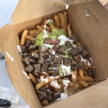 The Taco Stand - Carne Asada Fries, big enough to spit between 2 people! Squeeze some lime juice on top and load it with salsa - Tacos Near Me - Encinitas, California The Taco Stand - Carne Asada Fries, big enough to spit between 2 people! Squeeze some lime juice on top and load it with salsa - Tacos Near Me - Encinitas, California
