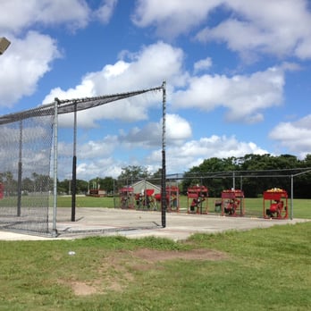 Bad Dog Driving Range - View of the batting cages and the machines - Golf Near Me - Orlando, Florida