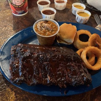 Central BBQ - Half rack with beans and onion rings. - Barbeque Near Me - Memphis, Tennessee Central BBQ - Half rack with beans and onion rings. - Barbeque Near Me - Memphis, Tennessee