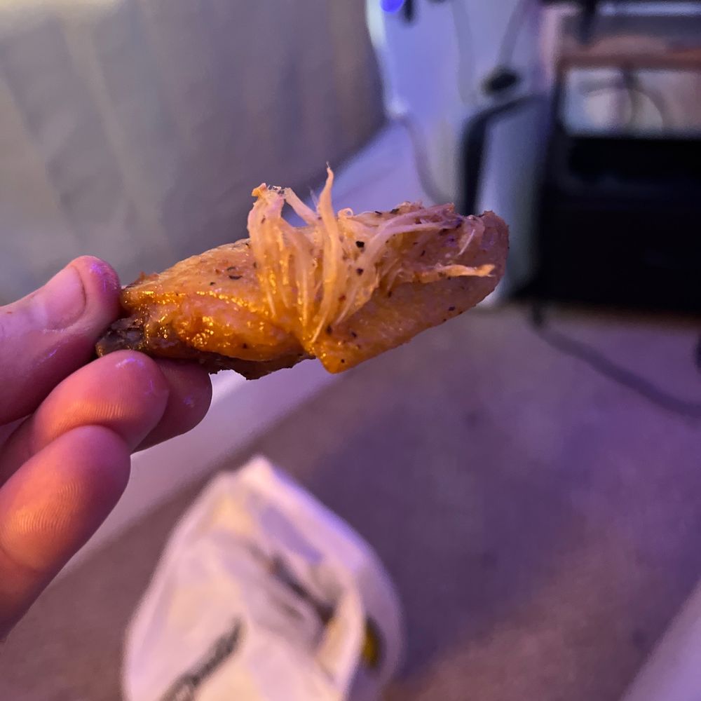 Feathers for extra flavor, or just lazy kitchen staff? Feathers for extra flavor, or just lazy kitchen staff?