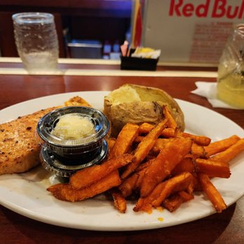 Ruby Tuesday - Grilled salmon with baked potato and sweet potato fries - American Near Me - Suffolk, Virginia