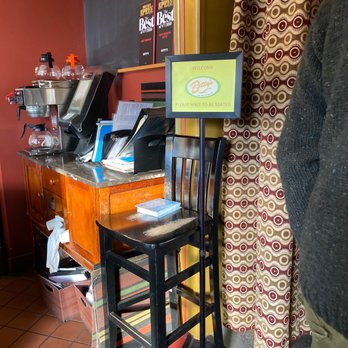 Betty's - a man standing in front of a counter - New American Near Me - Buffalo, New York