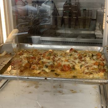 The Fish Company - a pizza in an oven - Seafood Near Me - Liverpool, New York
