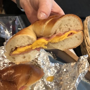 Cresskill Hot Bagels - a hand holding a sandwich - Bagels Near Me - Cresskill, New Jersey