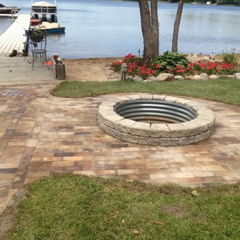 Penning Landscape Services - a fire pit on a brick patio - Landscaping Near Me Penning Landscape Services - a fire pit on a brick patio - Landscaping Near Me