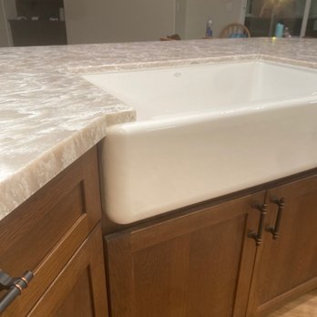 American Marble - a kitchen counter with a white sink - General Contractors Near Me - Vista, California American Marble - a kitchen counter with a white sink - General Contractors Near Me - Vista, California