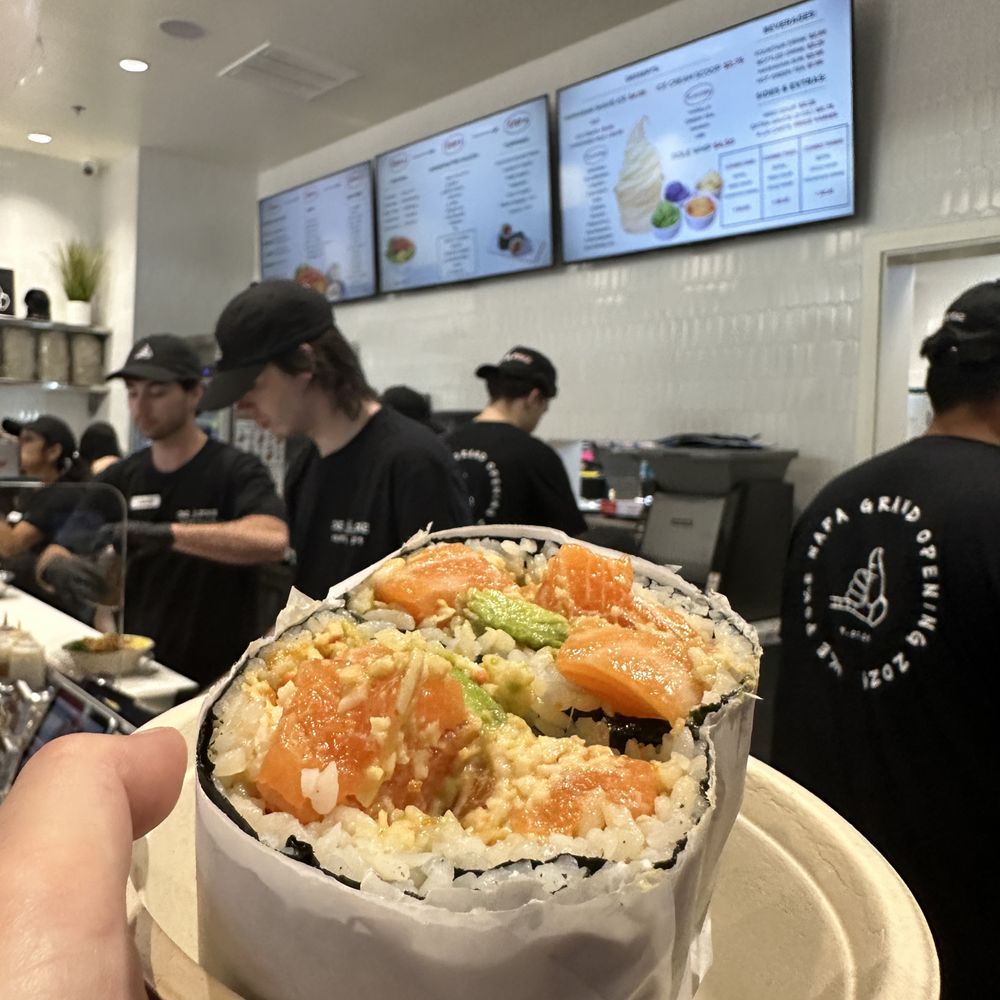 Oke Poke - Pokerrito with Salmon, Avocado, Masago, Imitation Crab and soy sauce. Wrapped in Sushi Rice and Nori. - Poke Near Me - Napa, California Oke Poke - Pokerrito with Salmon, Avocado, Masago, Imitation Crab and soy sauce. Wrapped in Sushi Rice and Nori. - Poke Near Me - Napa, California