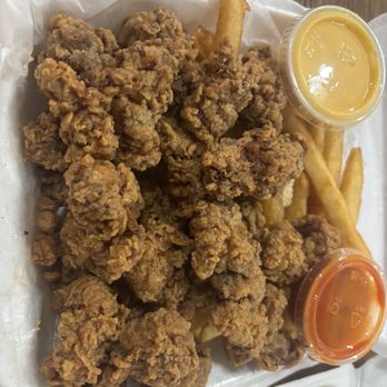 Miami Grill - Chicken gizzards with hot sauce and cheese fries - New American Near Me - St. Louis, Missouri Miami Grill - Chicken gizzards with hot sauce and cheese fries - New American Near Me - St. Louis, Missouri