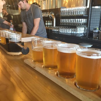 Good City Brewing - Two flights, curry fries (BEST FRIES ON THE PLANET), and pickled veggies! - Breweries Near Me - Milwaukee, Wisconsin
