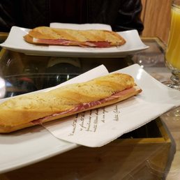 Jamon sandwich and orange juice Jamon sandwich and orange juice