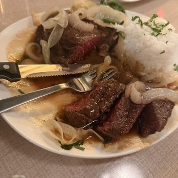 Rang’s Cocina Moderne - The Bistec cooked perfectly. Comes with onions and rice. - Spanish Near Me - Las Vegas, Nevada