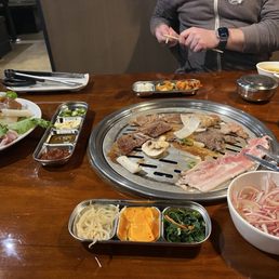 Option B from the BBQ menu: beef, chicken, kalbi, and pork belly along with the banchan, soup and rice. Option B from the BBQ menu: beef, chicken, kalbi, and pork belly along with the banchan, soup and rice.