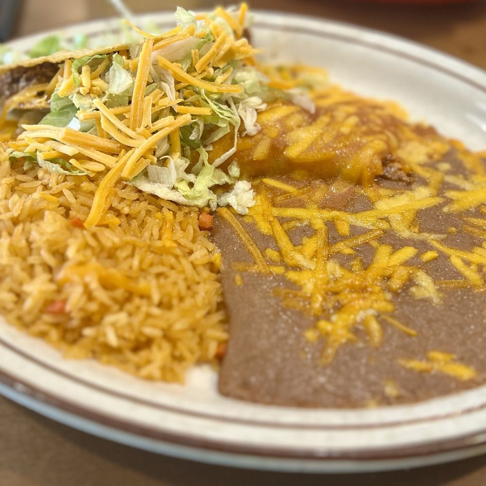 Fridas House Mexican Restaurant - Taco and Enchilada combo. Ground beef in taco is excellent as is the rice. Though they could leave out the peas. - Mexican Near Me - Casper, Wyoming Fridas House Mexican Restaurant - Taco and Enchilada combo. Ground beef in taco is excellent as is the rice. Though they could leave out the peas. - Mexican Near Me - Casper, Wyoming