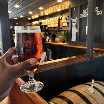 RT Rogers Brewing - a hand holding a glass of beer - Breweries Near Me - Sierra Madre, California RT Rogers Brewing - a hand holding a glass of beer - Breweries Near Me - Sierra Madre, California