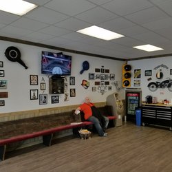 Van-tique Barbershop - A cozy, comfortable bench and interior for the occasional wait.