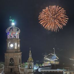 Beautiful night view of the church with firework in Puerto Vallarta
